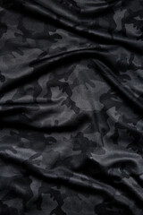 Camouflage pattern. Trendy dark gray camouflage fabric. Military texture. Dark back.