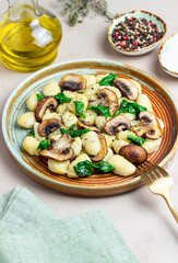 Gnocchi in a creamy sauce with mushrooms and spinach. Healthy eating. Vegetarian food.