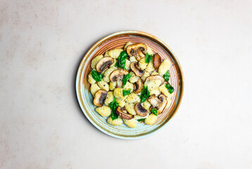 Gnocchi in a creamy sauce with mushrooms and spinach. Healthy eating. Vegetarian food.