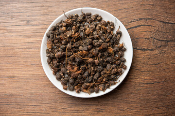 Ayurvedic Nagarmotha - Cyperus Scariosus or Cypriol in a bowl or heap
