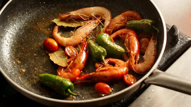 Cooking shrimps in frying pan