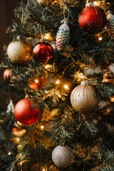 Obraz na płótnie Canvas Christmas tree decorated with colorful ornaments