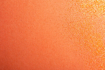 Shiny bright glitter on coral background, flat lay. Space for text