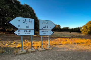 Signpost showing directions of Fes, Immouzzer, Ifrane and Azrou on the roadside