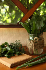 Fototapeta premium Different fresh green herbs on window sill indoors