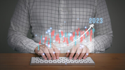 Businessman analyze company revenue growth to forecast year 2023 business, achievement, performance...