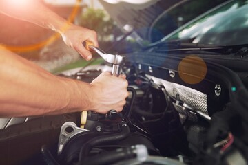 Fototapeta na wymiar Male mechanic fix a car in the garage