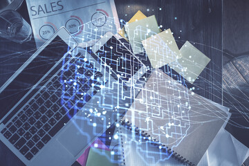 Double exposure of brain drawing hologram over topview work table background with computer. Concept of big data.