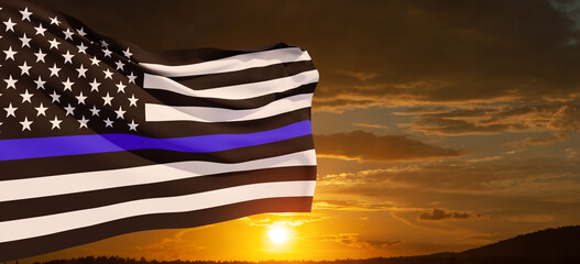 American flag with police support symbol Thin blue line on sunset sky. American police in society...