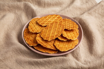 Homemade Waffle Crisps on a Plate, side view.