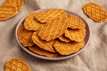 Homemade Waffle Crisps on a Plate, side view.