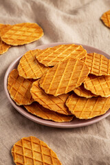 Homemade Waffle Crisps on a Plate, side view.
