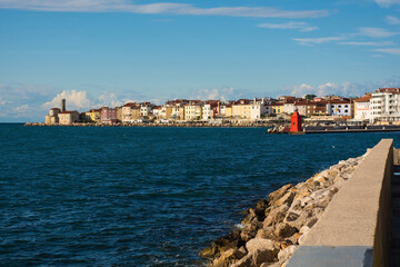 The waterfront of the historic medieval town of Piran on the coast of Slovenia. Background left is...