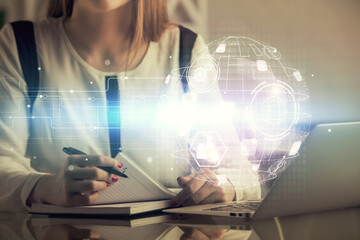 Double exposure of woman hands typing on computer and social network theme hologram drawing. People media concept.