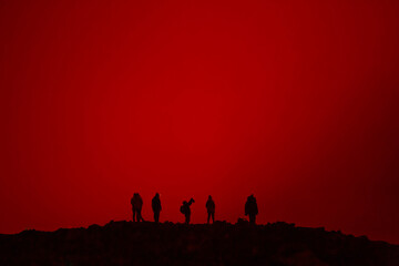 Volcanic eruption in iceland with people in the foreground