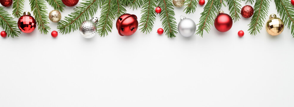 Christmas web banner with tree branches, decorations and ornations. Copy space for text.