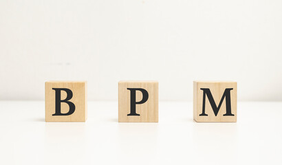 BPM Business Process Management concept, wooden word block on the white background