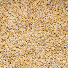 Dry oat flakes for porridge background