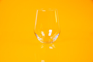 empty glass empty jar empty ice bucket on orange background
