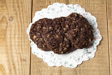 chocolate oatmeal cookies on wooden table