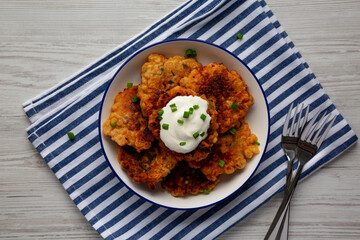 Homemade Fried Cheddar Corn Fritters on a Plate, top view. Flat lay, overhead, from above.