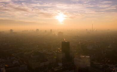 Fototapeta na wymiar Hazy, Foggy and Misty Zagreb Cityscape, Croatia. Sunset Light in Background