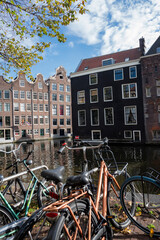Fototapeta na wymiar Amsterdam Netherlands city center view .Channel with houses and architecture on the shore