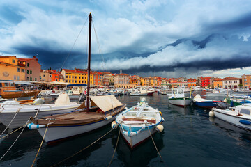 Fototapeta na wymiar storm clouds over marina in Rovinj town, Croatia.