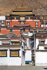 SHIGATSE, TIBET, CHINA: pilgrims in front of Tashi Lumpo Temple, the monastery is the seat of successive Panchen Lamas, in Gelugpa tradition (yellow hat tibetan buddhism)