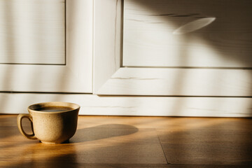 a cup of coffee on the parquet floor