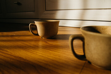 a cup of coffee on the parquet floor