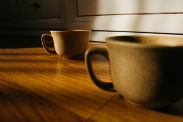 a cup of coffee on the parquet floor