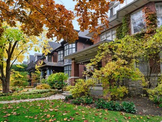 Residential street with old two story houses in autumn