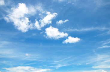 The sky is large, bright, beautiful and has white clouds.