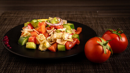 Green vegan salad from green leaves mix and vegetables. fresh vegetables salad plate