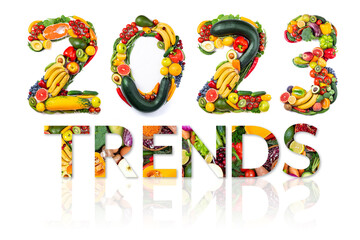 New year 2023 food trends. New Year 2023 made of vegetables, fruits and fish on white background....