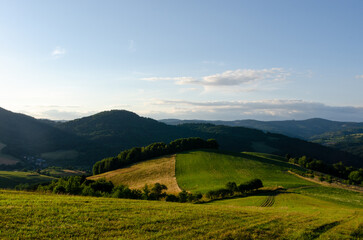Fototapeta na wymiar A picturesque view of mountains, forests and a colourful farmland in Slovakia.