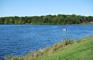 September 28, 2022. Shabbona Lake State Park, Shabbona, Illinois, USA. Two people in a boat on the beautiful lake.