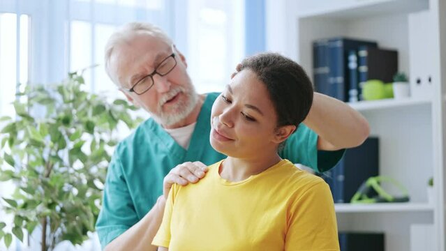 Happy woman feeling no neck pain during medical check-up, healing process