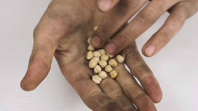 People starving and impoverished as a result of drought and food crisis.
Dirty hands showing his leftover food as a result of the food and drought crisis.
