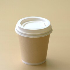 Small disposable recycled paper espresso coffee cup with white plastic lid
