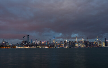 NYC Cityscape with Stormy Cloudy Blue Sky in Background