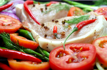 Meat with spices, onions, red and green peppers, ginger, tomatoes