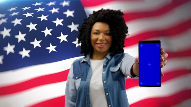 African American woman showing smartphone with pre-keyed screen, vote online