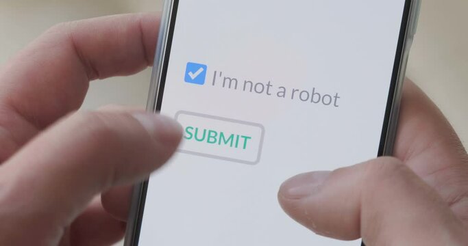 Finger taps I m not a robot checkbox on phone screen, then on submit button. Concept, technology, human check, verification.