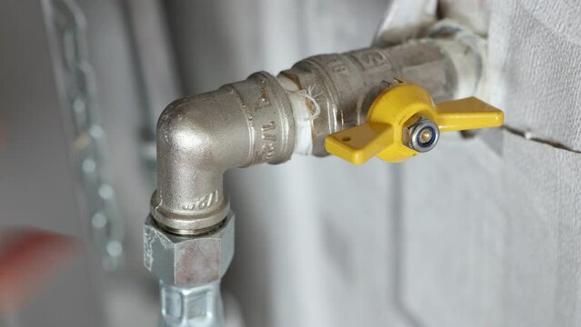 Turning off household house natural gas main shut off valve before disconnecting flexible gas line from pipeline.