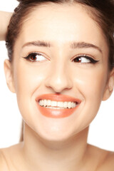 Obraz premium Beautiful girl close up studio portrait against white background.