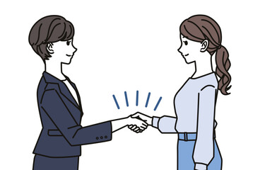 Fototapeta premium Two businesswomen shaking hands in agreement