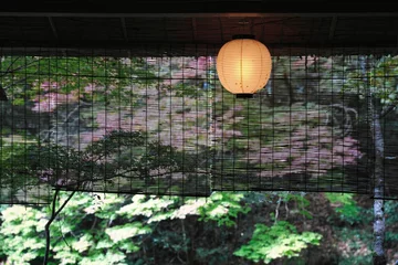 Printed roller blinds Kyoto Kyoto,Japan - October 30, 2022: Autumn leaves beyond bamboo blind in Kyoto, Japan 
