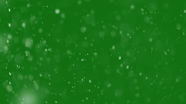 Heavy Christmas snowfall. Blurred snow background on green screen
